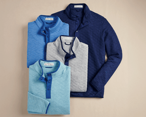 The Sullivan Quarter-Snap: Heathered Maidstone Blue, a quilted jersey pullover with snap-button collar, offers soft insulation and classic styling for versatile wear.