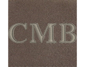 Close-up of The Travis Tote Bag Cotton Twill: Scotch Green, showcasing CMB embroidery on durable, tightly woven fabric, highlighting personalization detail.